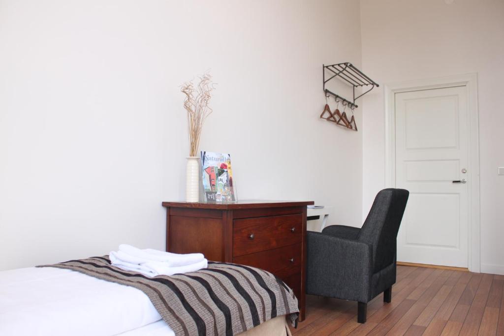 Postel nebo postele na pokoji v ubytování Guesthouse Eleven Hotel