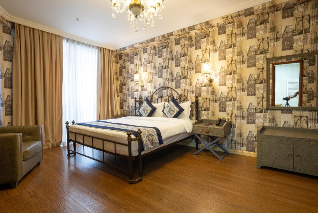Postel nebo postele na pokoji v ubytování Panorama Lisi Grand Hotel