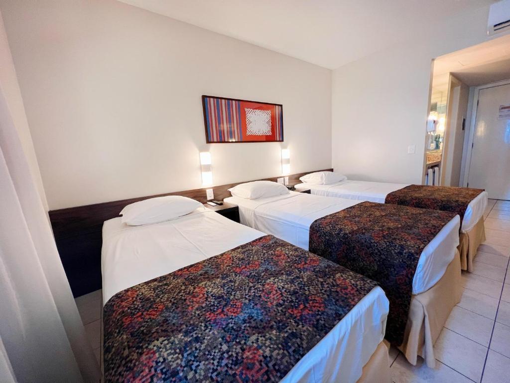 Postel nebo postele na pokoji v ubytování Hotel Sonata de Iracema
