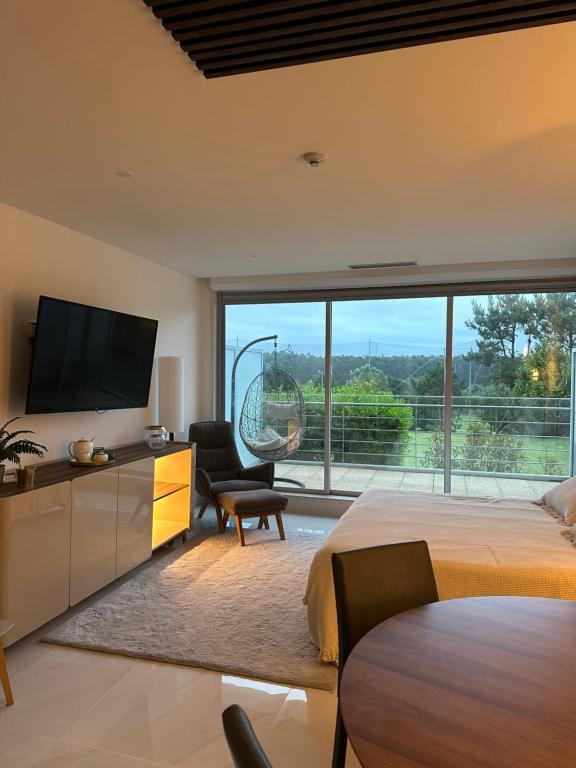 TV a/nebo společenská místnost v ubytování Studio Luxury Quinta da Barca
