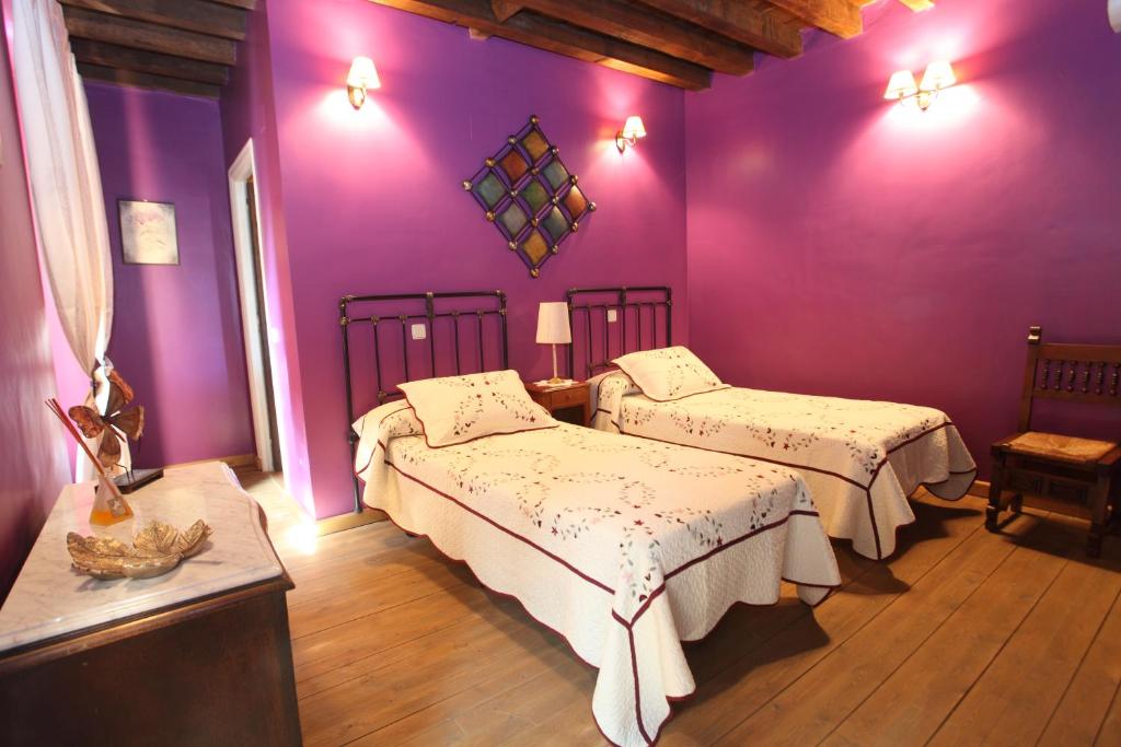 A bed or beds in a room at Posada Villa Maria