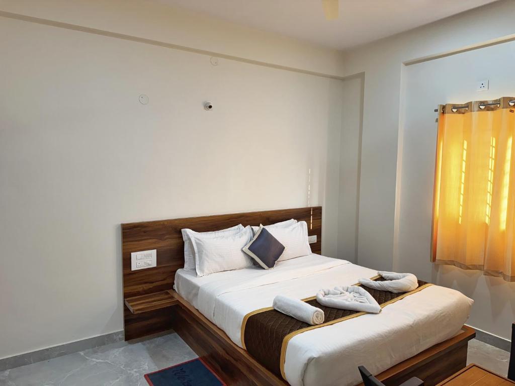 Ένα ή περισσότερα κρεβάτια σε δωμάτιο στο Grs Comforts Lodge