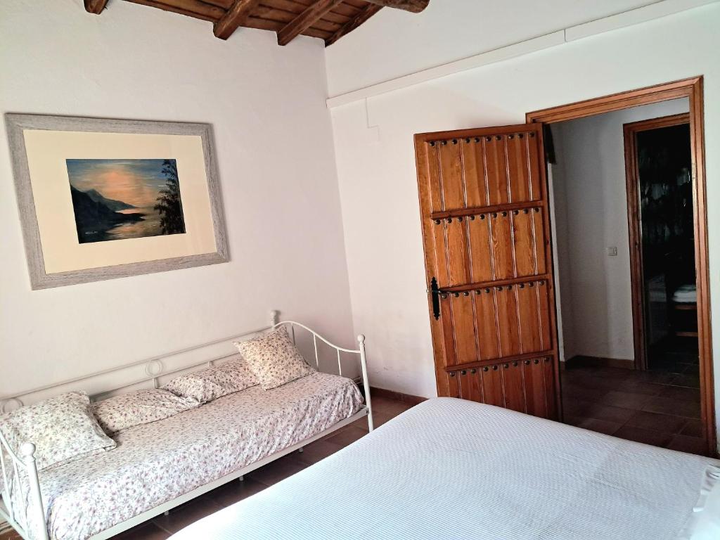 Cama o camas de una habitación en El Jiniebro Turismo Rural