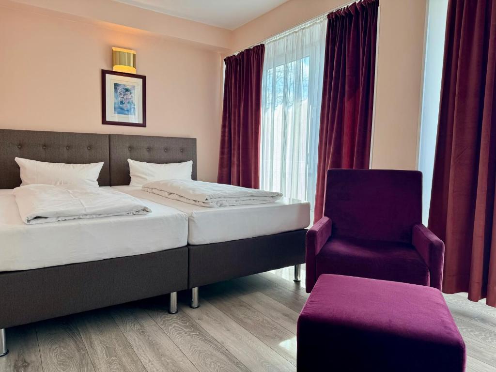 Ένα ή περισσότερα κρεβάτια σε δωμάτιο στο Hotel Nevada Hamburg