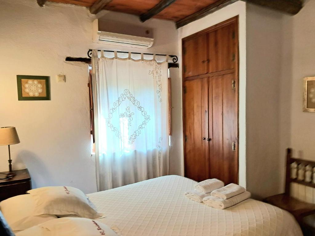 Cama o camas de una habitación en El Jiniebro Turismo Rural