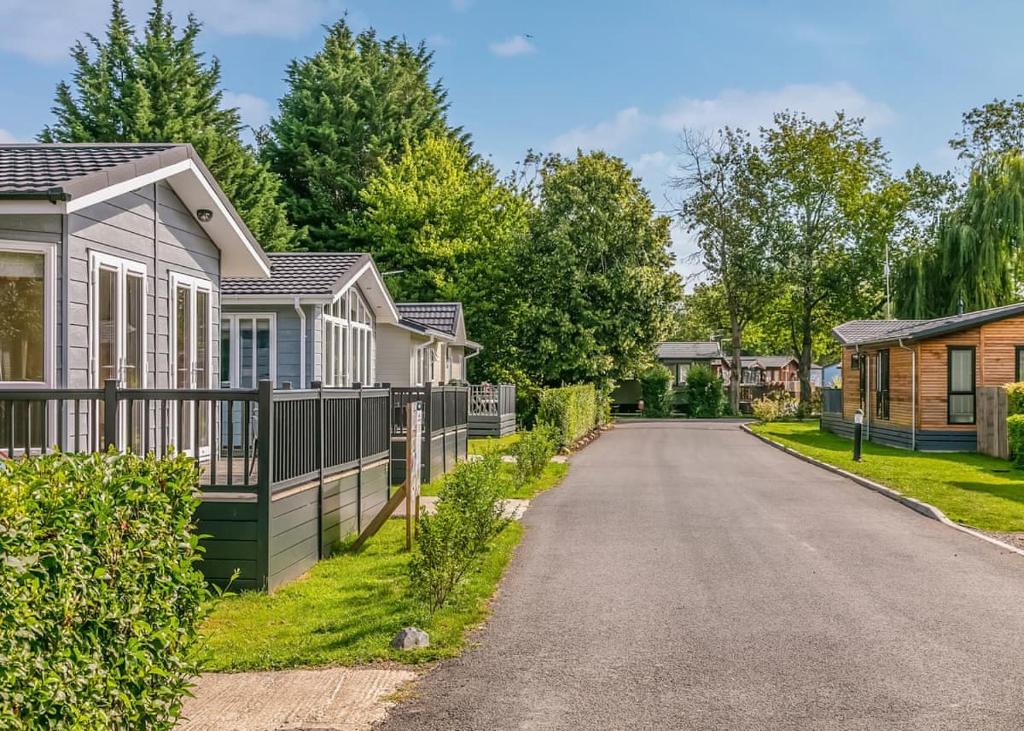 a row of houses on a street at Roydon Marina Village in Roydon