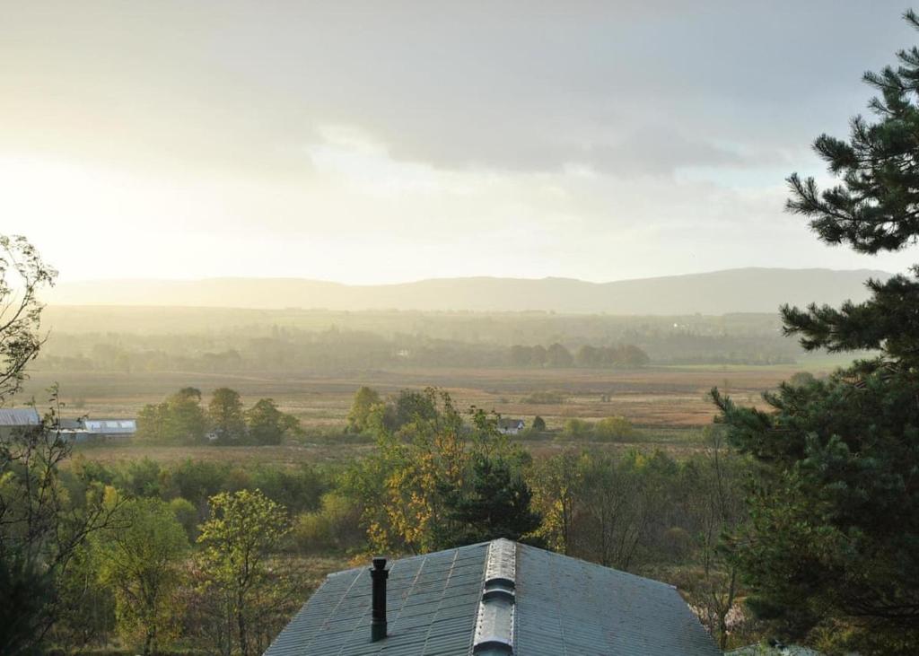 a roof of a house with a view of a field at Trossachs Holiday Park in Gartmore