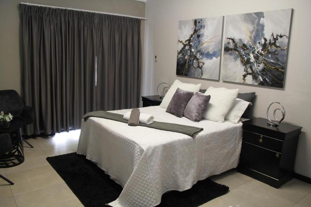 Postel nebo postele na pokoji v ubytování Aeon Guest House & Spa