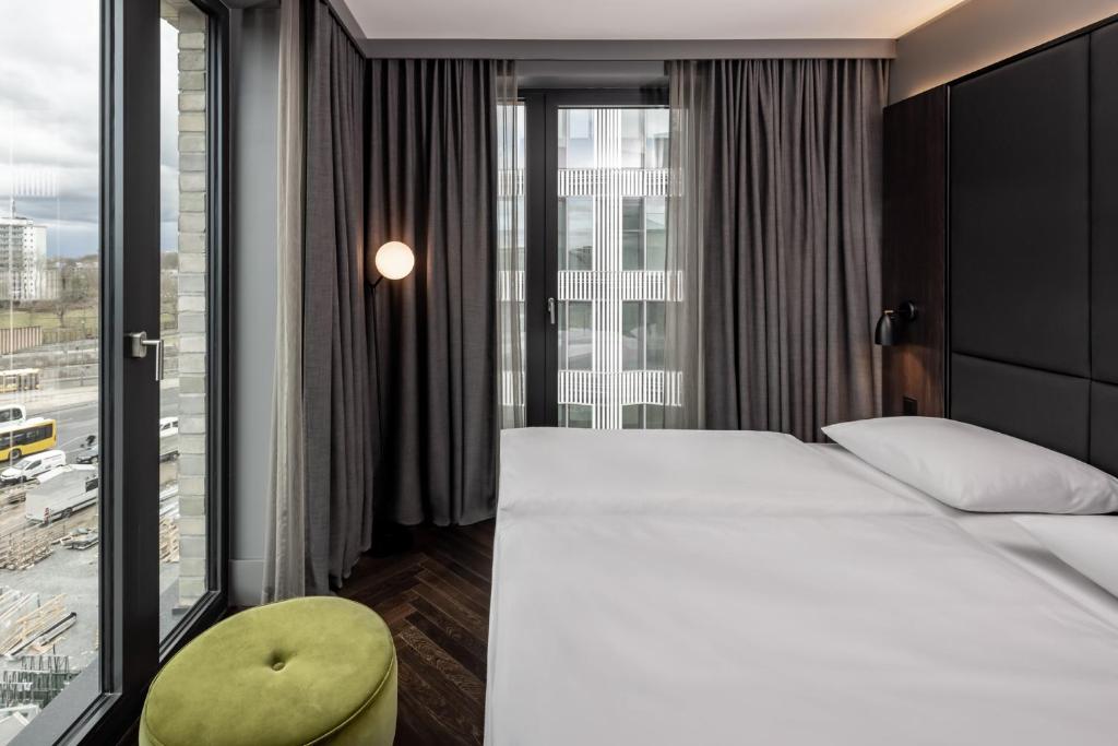 Postel nebo postele na pokoji v ubytování Hotel ROMY by AMANO