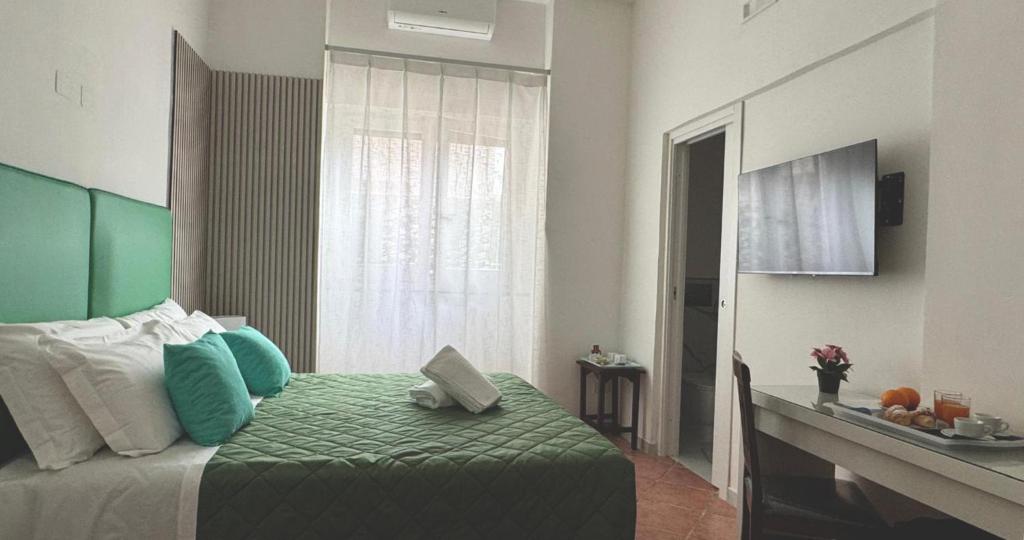 Postel nebo postele na pokoji v ubytování Ambasciata Sorrento Relais