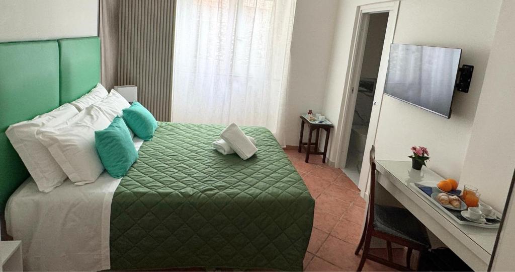 Postel nebo postele na pokoji v ubytování Ambasciata Sorrento Relais