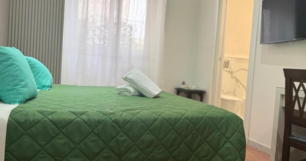 Postel nebo postele na pokoji v ubytování Ambasciata Sorrento Relais