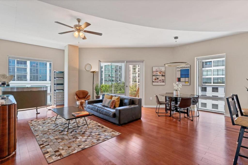 a living room with a couch and a table at Beautiful Downtown Condo 1 Bed 1 Bath in Orlando