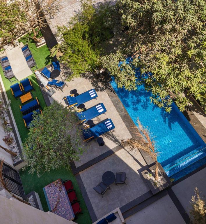 an overhead view of a swimming pool with lounge chairs at Exclusive stay with luxury touches at 22 by spacey #55 Studio in Maadi in Cairo