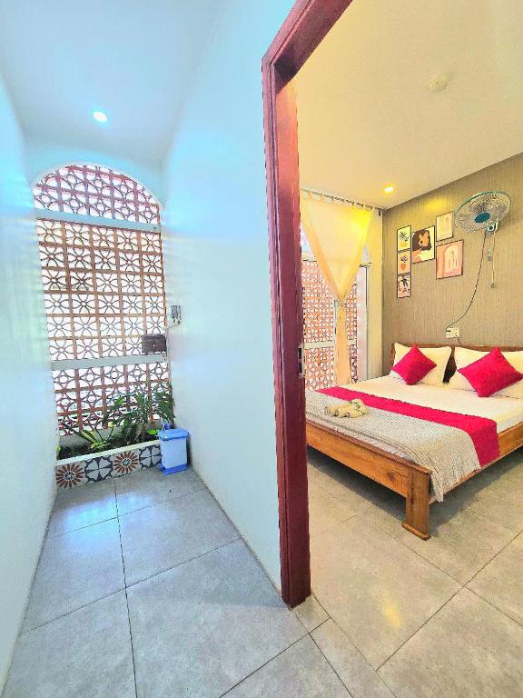 Postel nebo postele na pokoji v ubytování MEKONG HUB Hotel