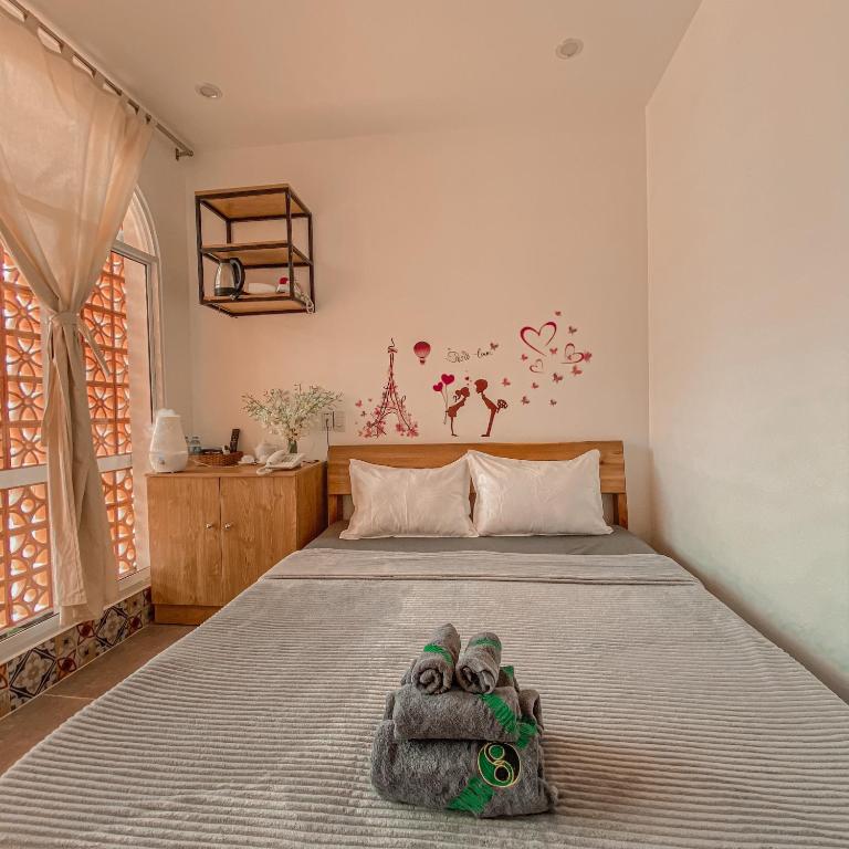 Postel nebo postele na pokoji v ubytování MEKONG HUB Hotel