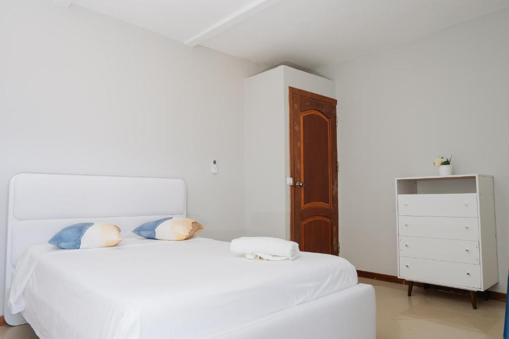 Postel nebo postele na pokoji v ubytování Praia Guest House
