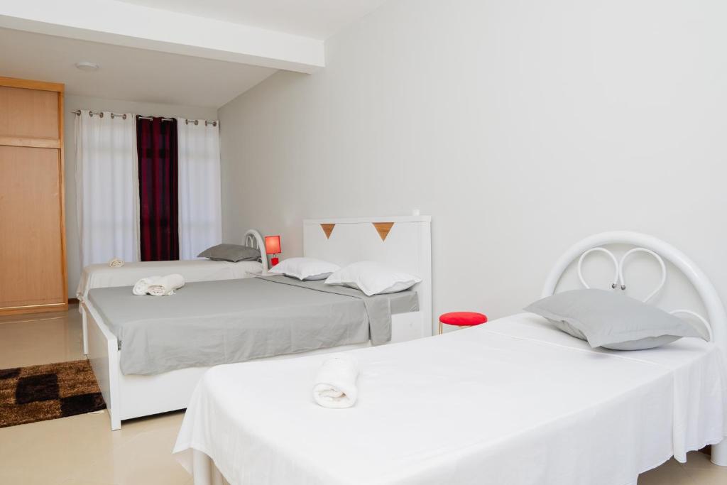 Postel nebo postele na pokoji v ubytování Praia Guest House