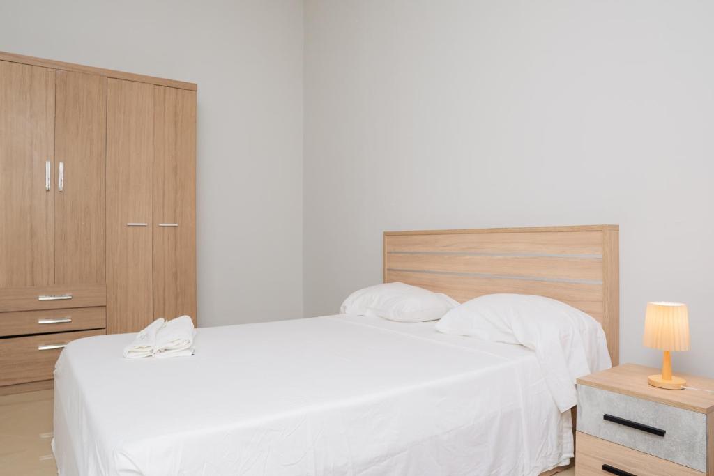 Postel nebo postele na pokoji v ubytování Praia Guest House