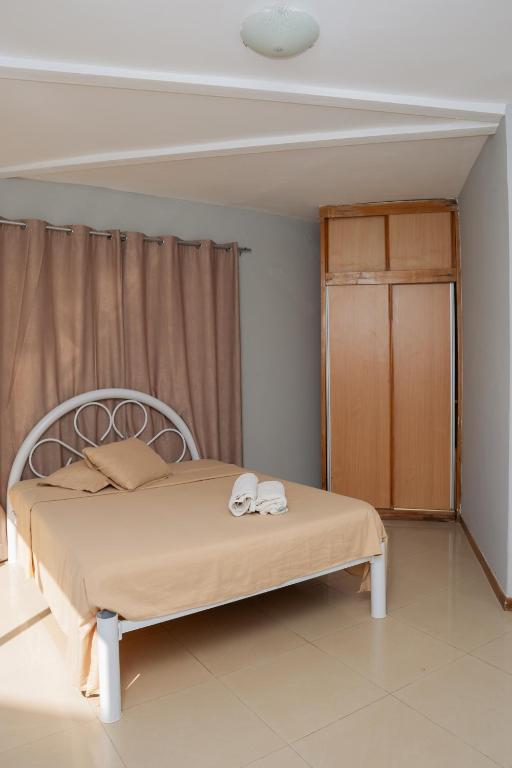 Postel nebo postele na pokoji v ubytování Praia Guest House