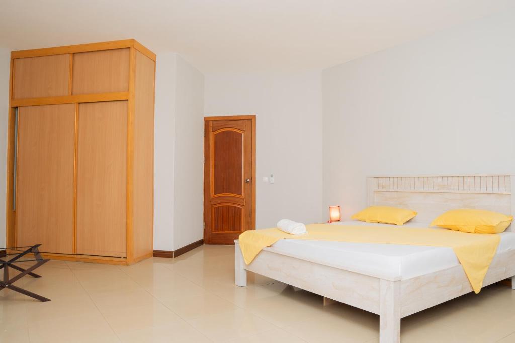 Postel nebo postele na pokoji v ubytování Praia Guest House