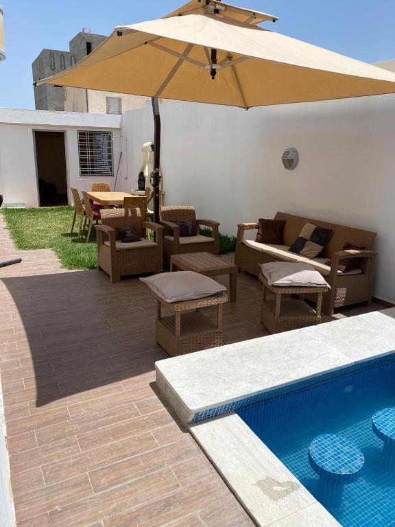 Bazén v ubytování Le Coin Paradisiaque nebo v jeho okolí