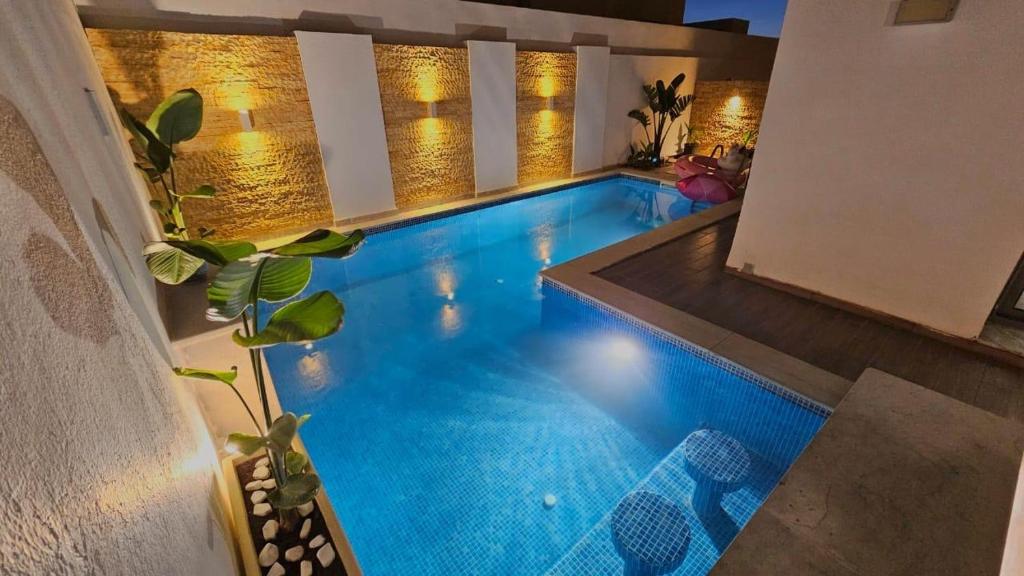 Bazén v ubytování Le Coin Paradisiaque nebo v jeho okolí