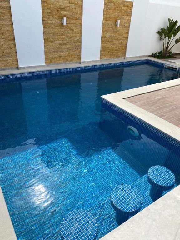 Bazén v ubytování Le Coin Paradisiaque nebo v jeho okolí