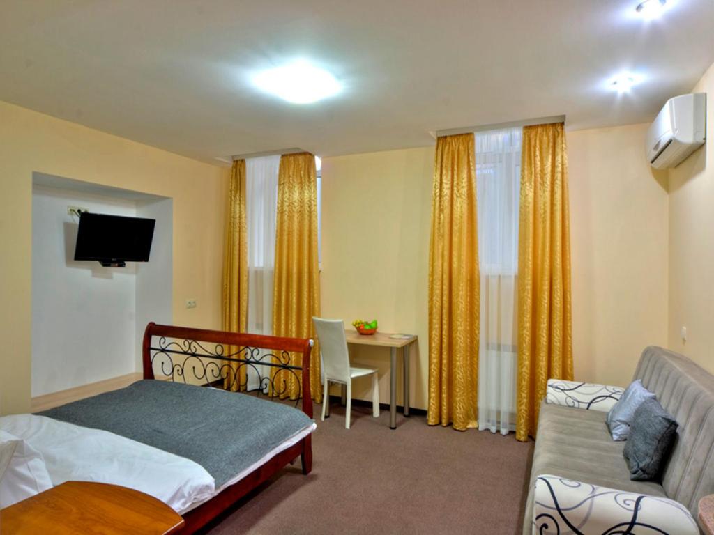 Postel nebo postele na pokoji v ubytování Golden Gate Inn