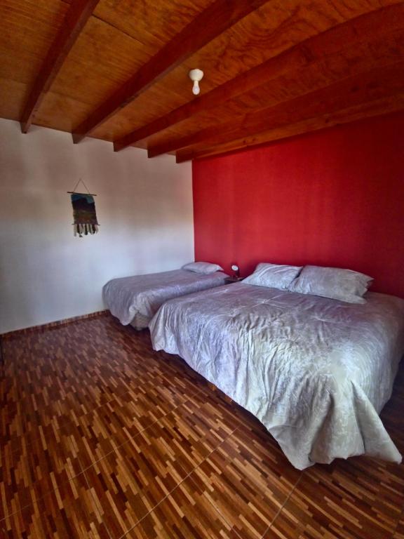 Postel nebo postele na pokoji v ubytování Hostal Perita
