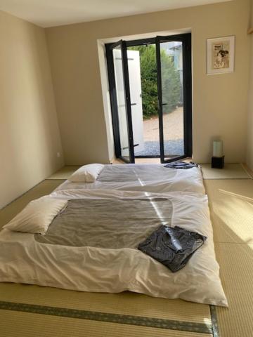 Postel nebo postele na pokoji v ubytování Maison Shizen