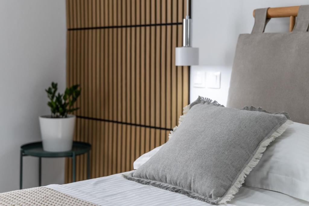 Postel nebo postele na pokoji v ubytování Melian Roots Apartment
