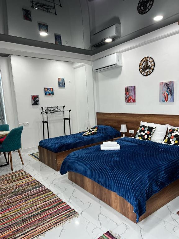 Postel nebo postele na pokoji v ubytování Kutaisi Apartment