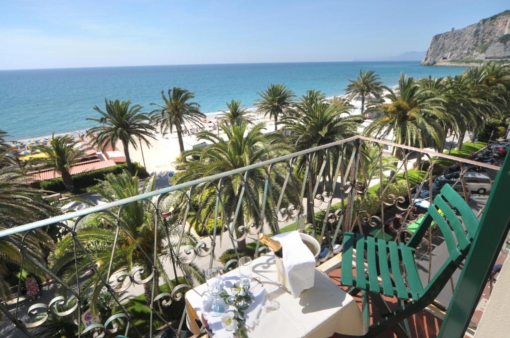 a view of the beach from the balcony of a resort at Hotel Gambone in Finale Ligure