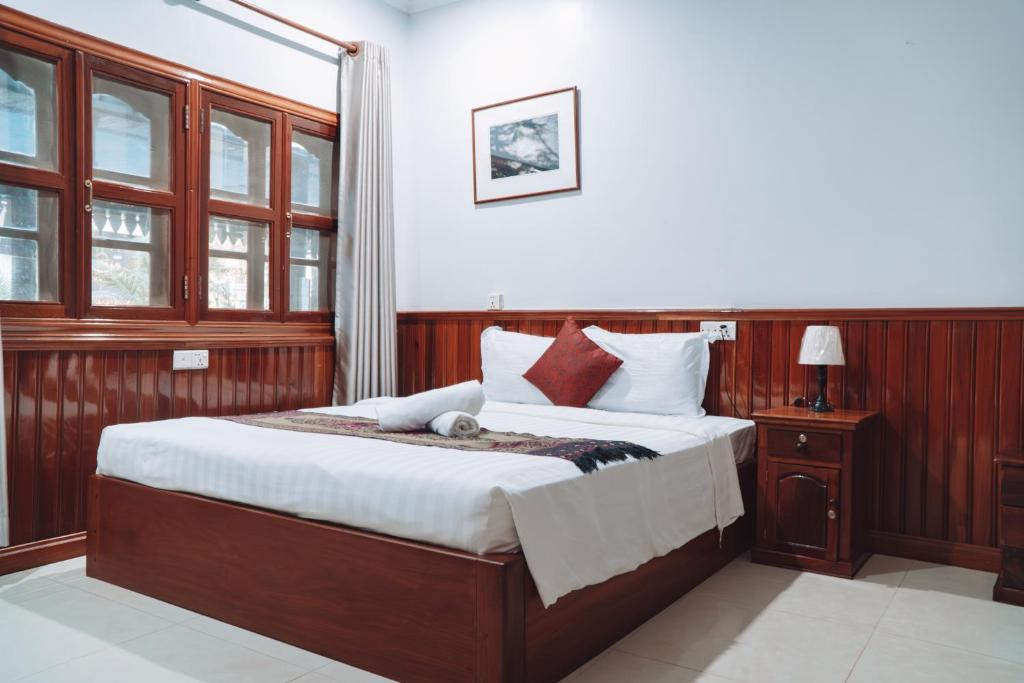 Postel nebo postele na pokoji v ubytování MONY SOKSAN Residence
