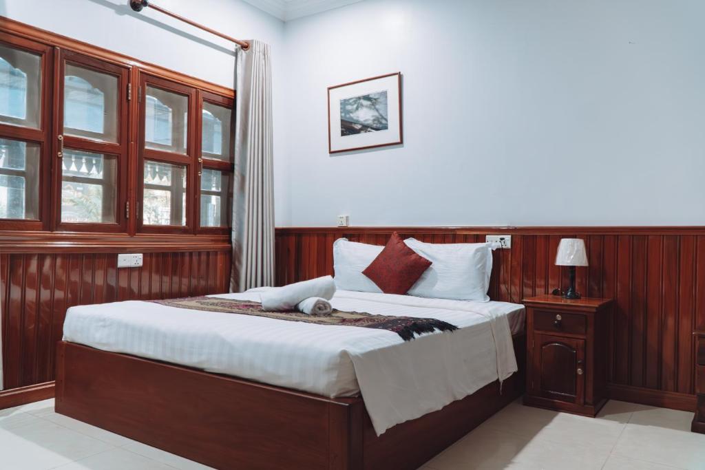 Postel nebo postele na pokoji v ubytování MONY SOKSAN Residence