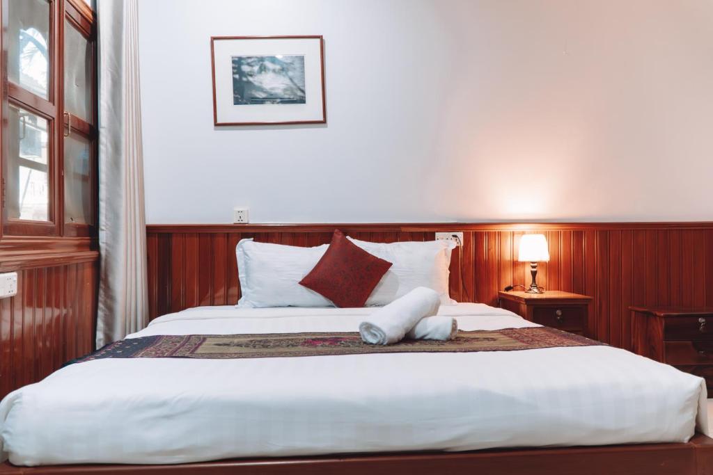 Postel nebo postele na pokoji v ubytování MONY SOKSAN Residence