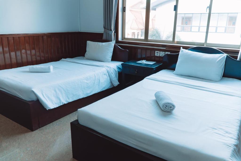 Postel nebo postele na pokoji v ubytování MONY SOKSAN Residence