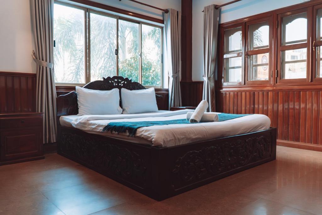 Postel nebo postele na pokoji v ubytování MONY SOKSAN Residence
