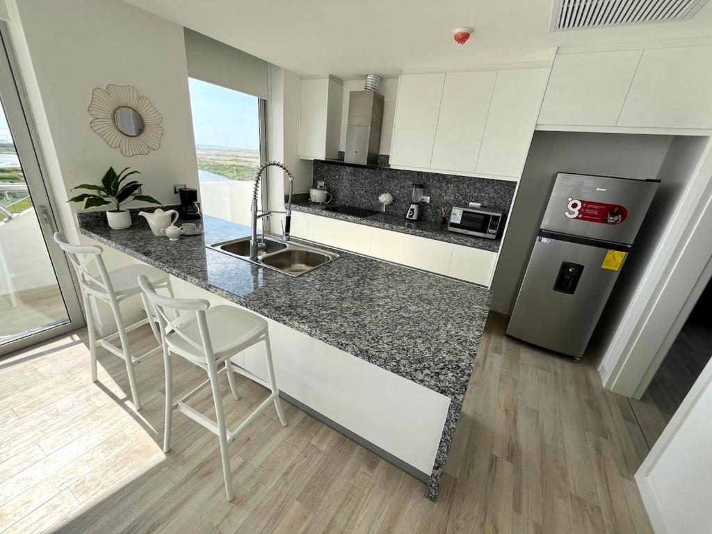 Kuchyň nebo kuchyňský kout v ubytování Karibao Ecuabook Familiar 7A