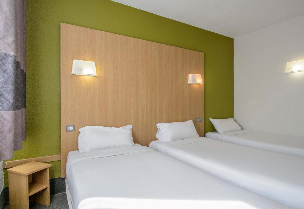 Postel nebo postele na pokoji v ubytování B&B HOTEL Nîmes Ville Active, parking sécurisé gratuit