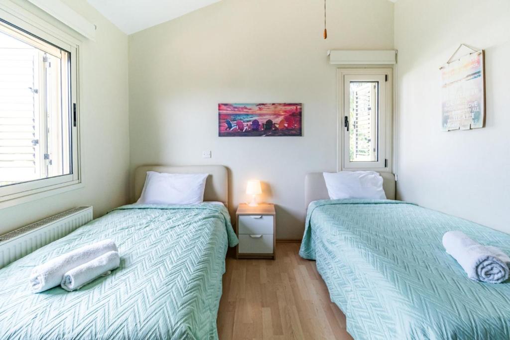Postel nebo postele na pokoji v ubytování Villa Venus by Ezoria Villas
