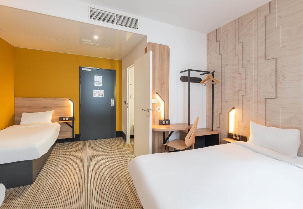 Postel nebo postele na pokoji v ubytování B&B HOTEL Lyon Ouest Tassin