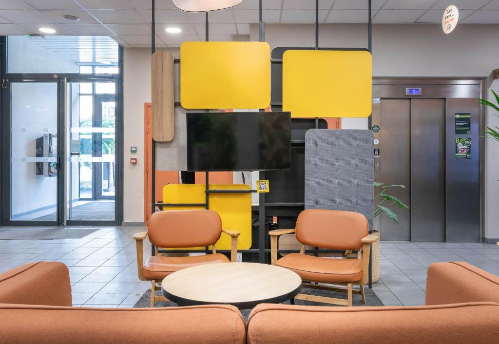 Kuchyň nebo kuchyňský kout v ubytování B&B HOTEL Lyon Ouest Tassin