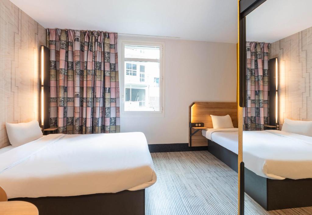 Postel nebo postele na pokoji v ubytování B&B HOTEL Lyon Ouest Tassin
