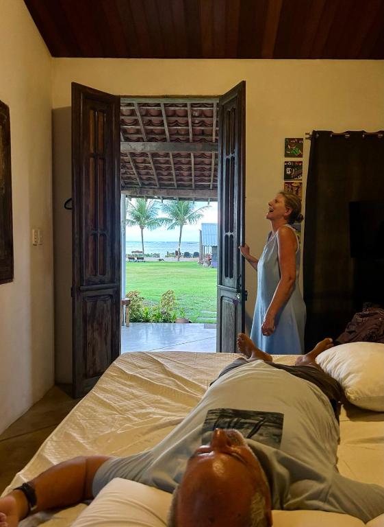 Uma cama ou camas num quarto em Pousada Vila do Patacho