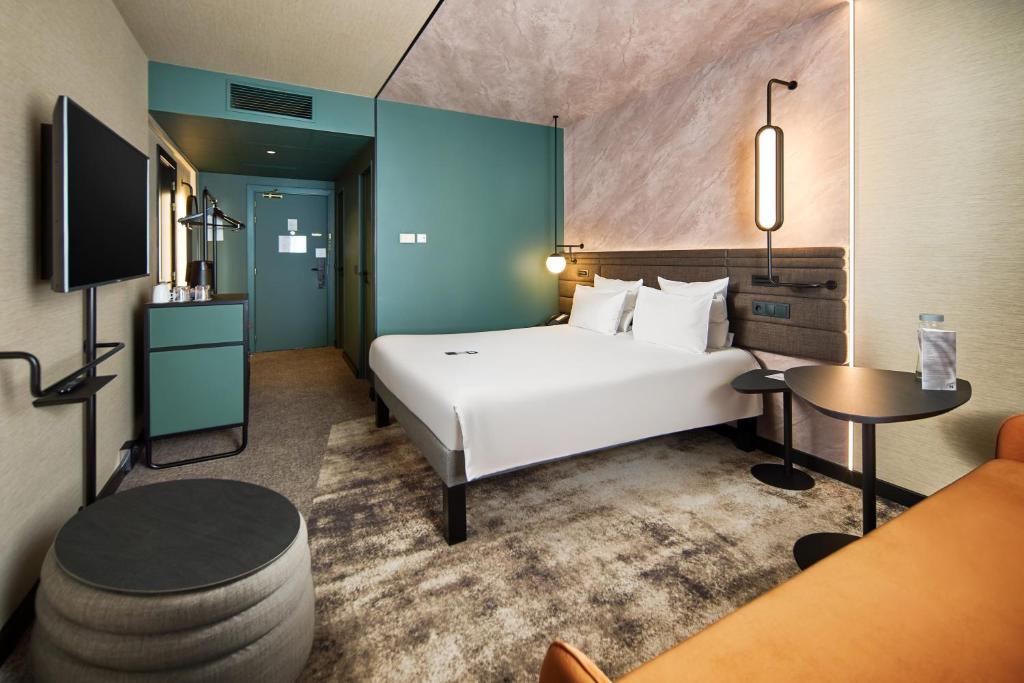 Postel nebo postele na pokoji v ubytování Novotel Praha Wenceslas Square