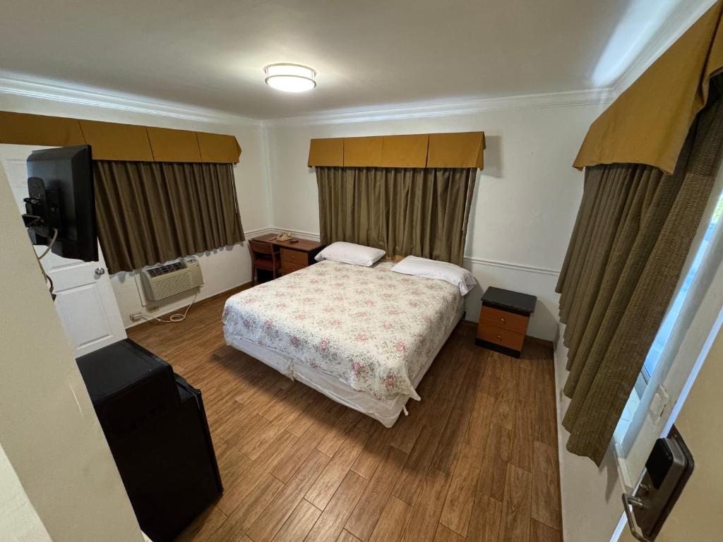 Postel nebo postele na pokoji v ubytování King Motel - Miami