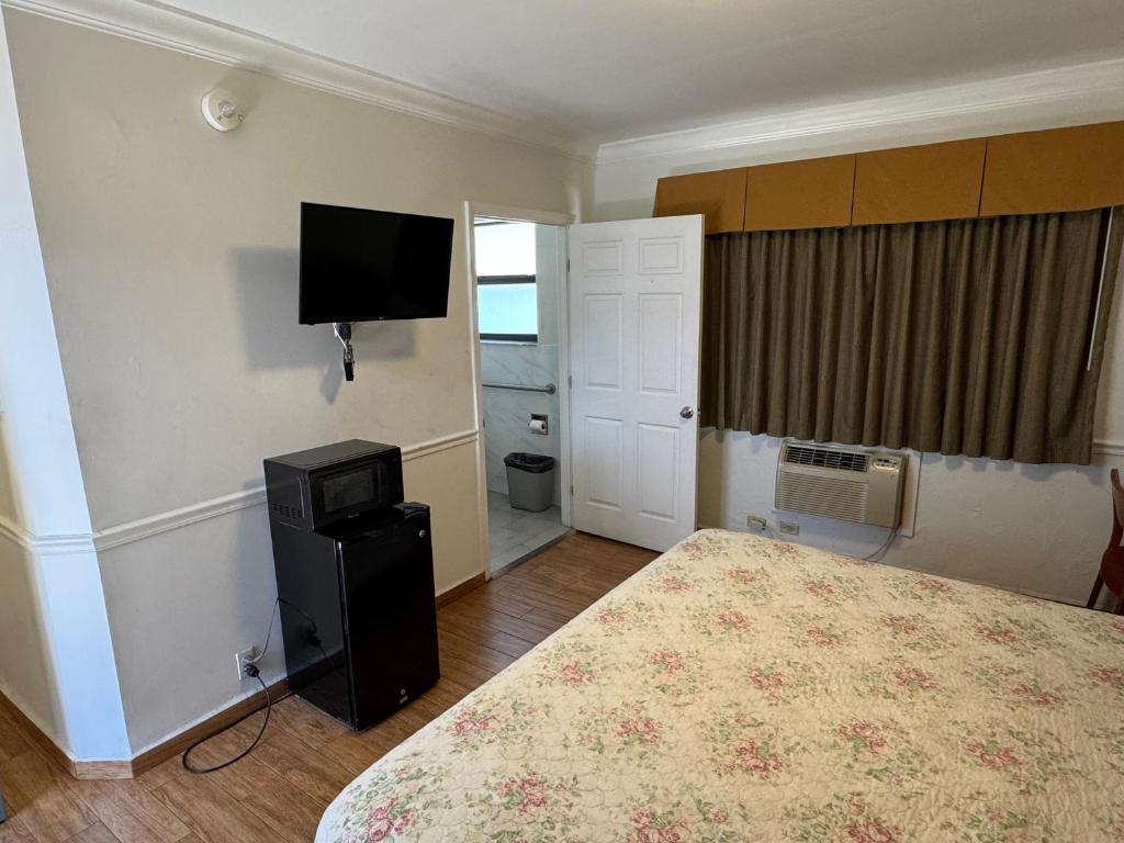 TV a/nebo společenská místnost v ubytování King Motel - Miami
