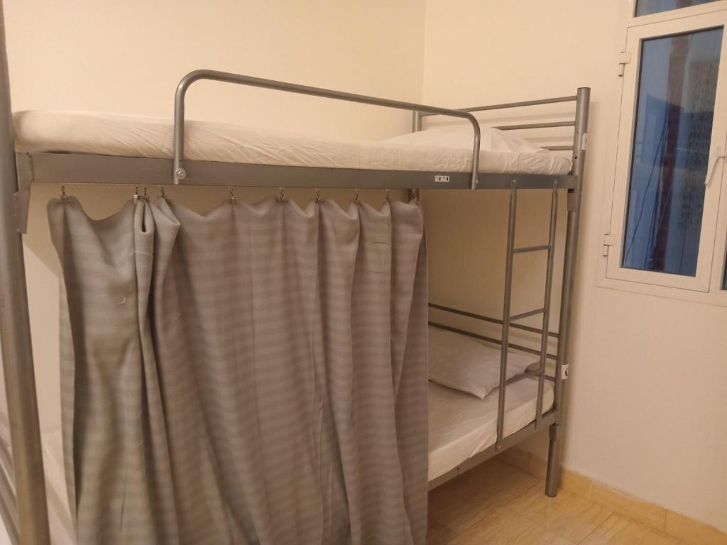 Postel nebo postele na pokoji v ubytování Heritage Hostel Muscat